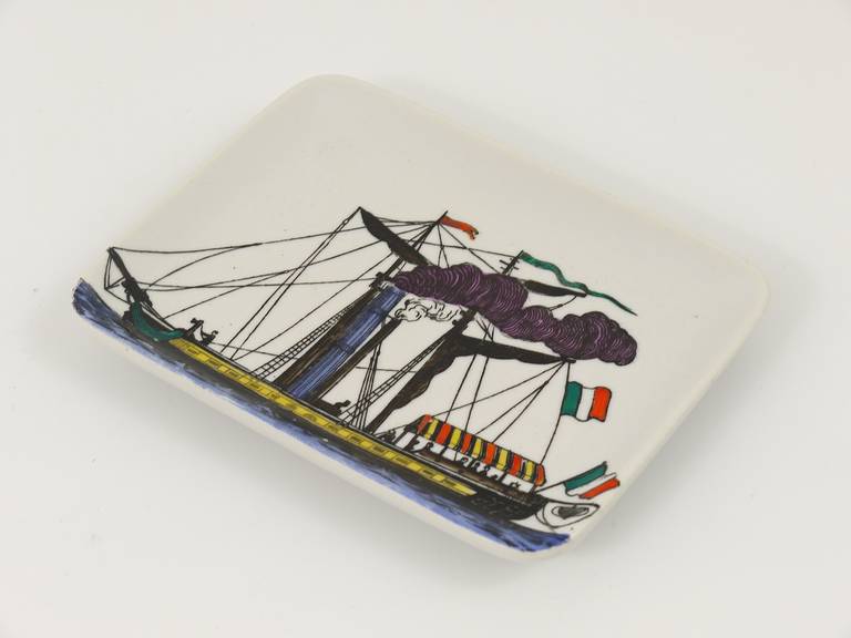 A beautiful square plate displaying a ship. From the 1970s, by Piero Fornasetti. Very good condition.