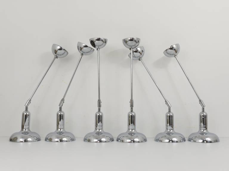 Up to six beautiful, identical, chrome-plated pendant lights from the 1970s. Adjustable by an integrated hinge. In the style of Gino Sarfatti.  Executed in the 1970s by Gebrüder Cosack in Germany. In very good condition. Offered as a set of six, but