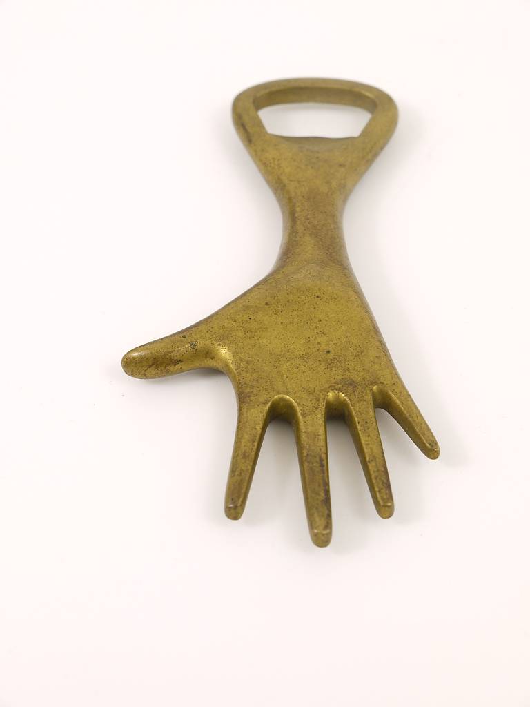 A beautiful bottle opener in the shape of a hand, designed and executed in the 1950s by Carl Aubock, Vienna. Very good condition, nice patina. 5