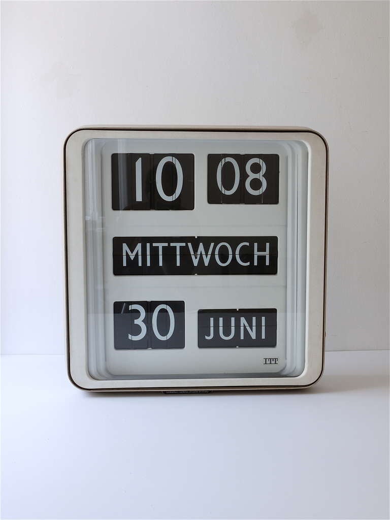 Big loft wall clock Dator 10, from the 1960s. Designed by Gino Valle, produced by Solari/Udine/Italy. The display shows time, day, date and month. In very good condition, measures 24 x 24 inch , the numbers are 4 inch high. This clock was made to be