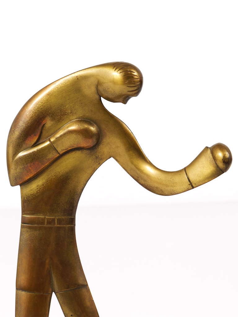 A very beautiful Art Deco brass cast sculpture, displaying a left-handed boxer. Designed and executed in Vienna by Carl Auböck (1900- 1957), dated circa 1928-1930. It has a height of 11 inch. This is a early work of Carl Auböck, only a very few
