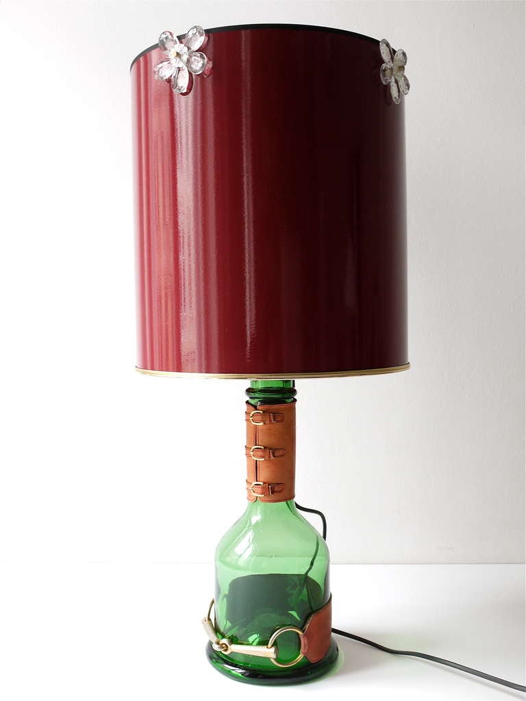 An outstanding Gucci side lamp. Its base is handblown from green Murano glass, covered with brown leather. The neck and sockets are gold-plated. Marked on the leather. The lampshade has been restored by a professional lampshade-maker, using all