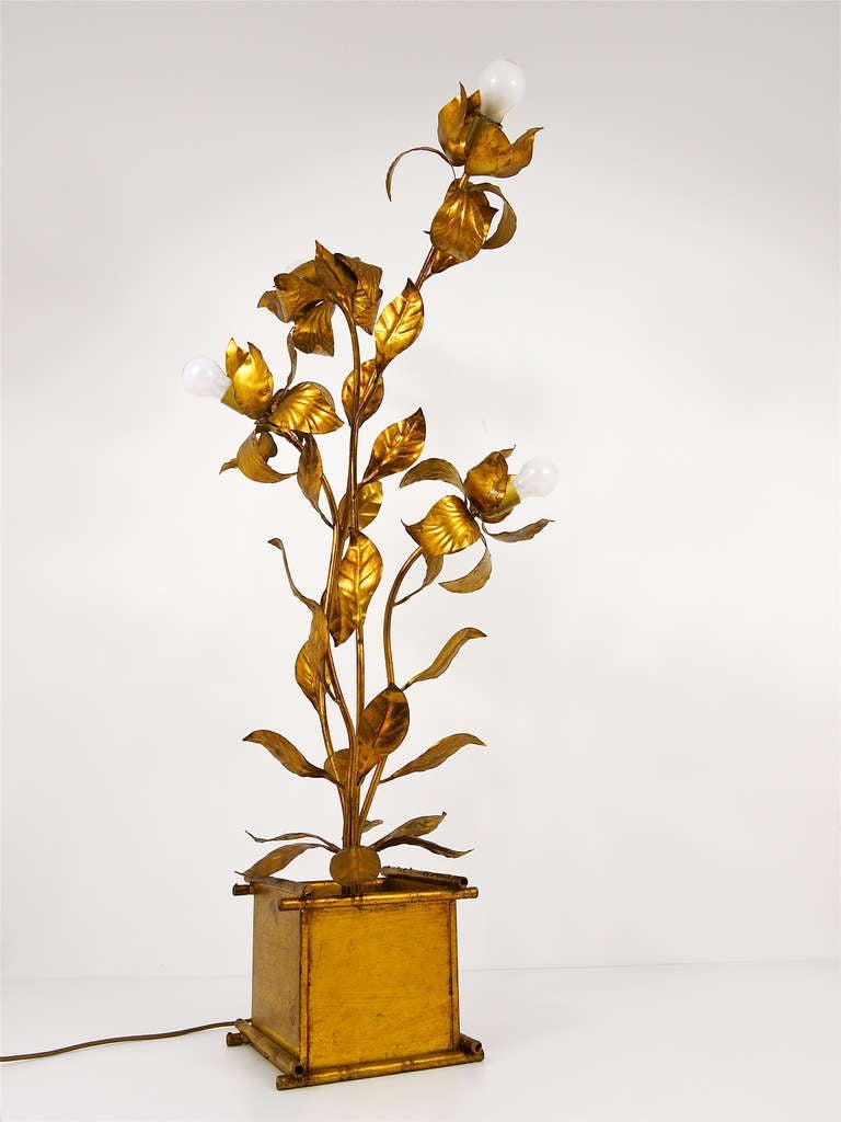 A very spectacular large vintage floral leaf lamp. Made in Italy in the 1970s. In the manner of Tommaso Barbi. Has a faux bamboo flowerpot base, made of gilded wood, leaves from gilded metal.  Very good condition. 49 in;/125cm high. A very unusual