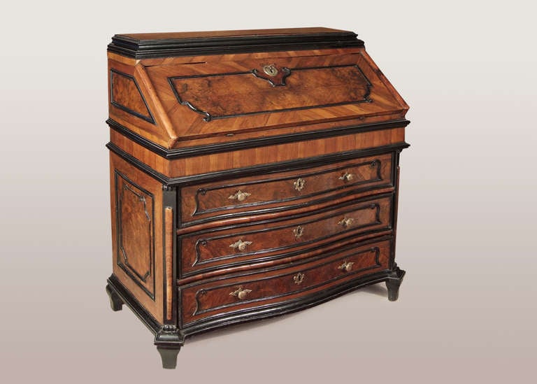 A North Italian walnut and ebonized bureau , Lombardy first half 18.th c.