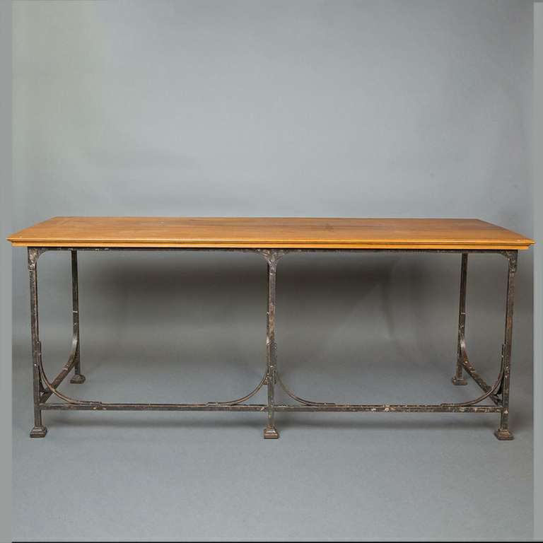 A French industrial table with a metal frame and oak top, early 20th century