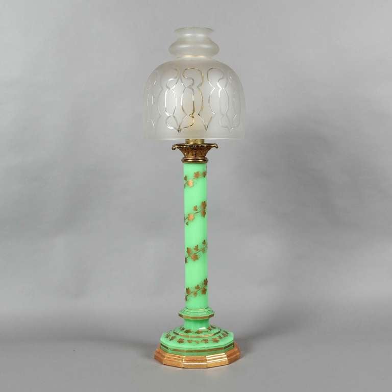 A 19th century green opaline glass and gilt brass lamp with decorated column