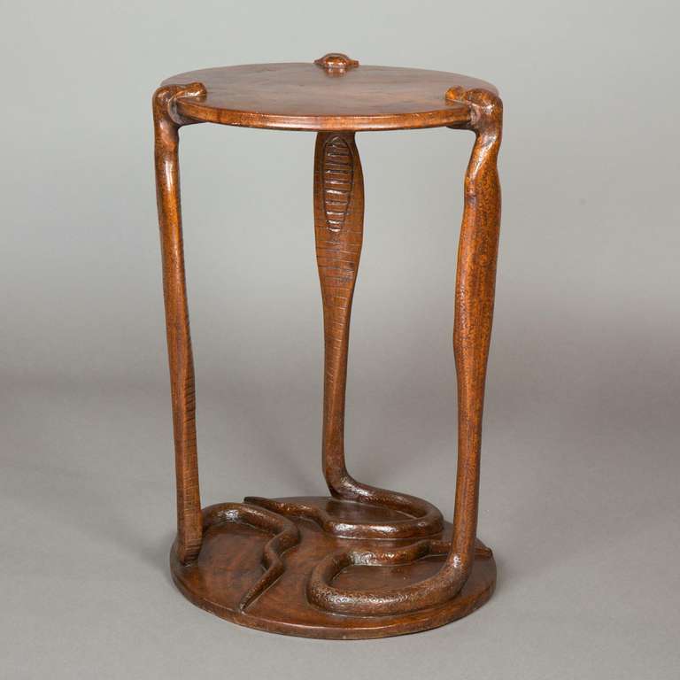 An early 20th century Anglo-Indian table with cobra snake legs.
