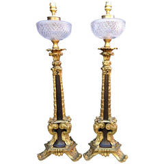 Ormolu oil lamps with glass reservoirs