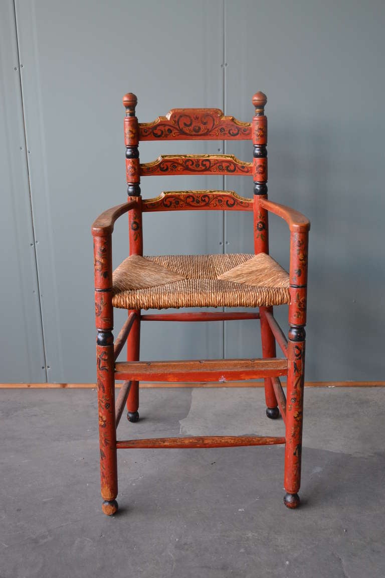 Fantastic and durable 19th century original Hindeloopen painted ladder back children's armchair. The wonderful original hand woven rush seat is in very good condition. Ideal as side or computer chair.

Dutch Folk Art painted furniture