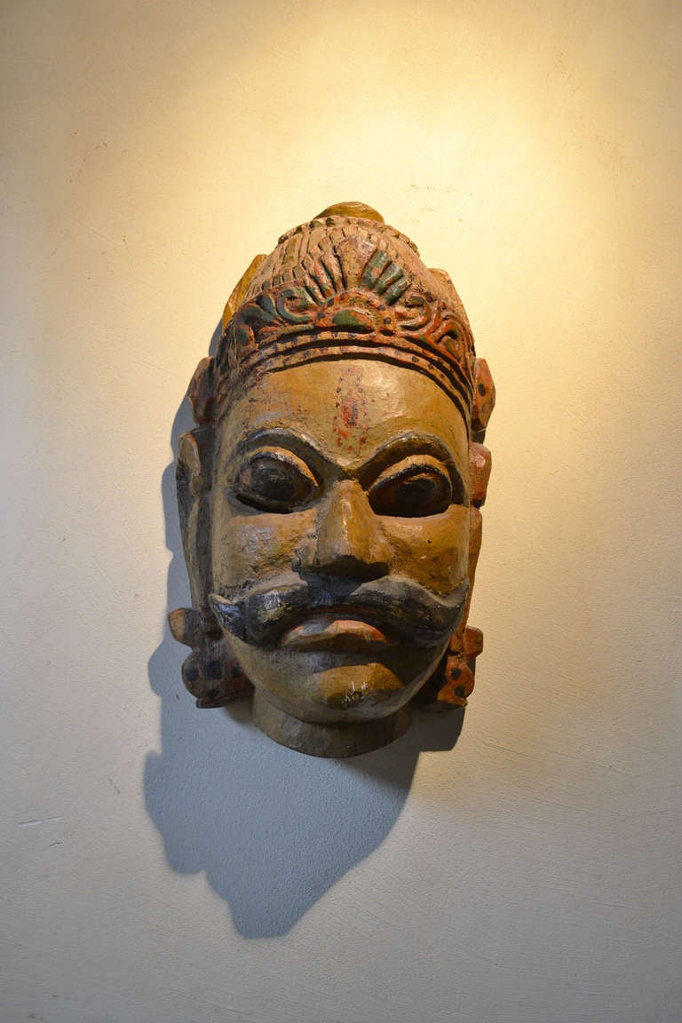 Nicely carved wooden polychrome mask.