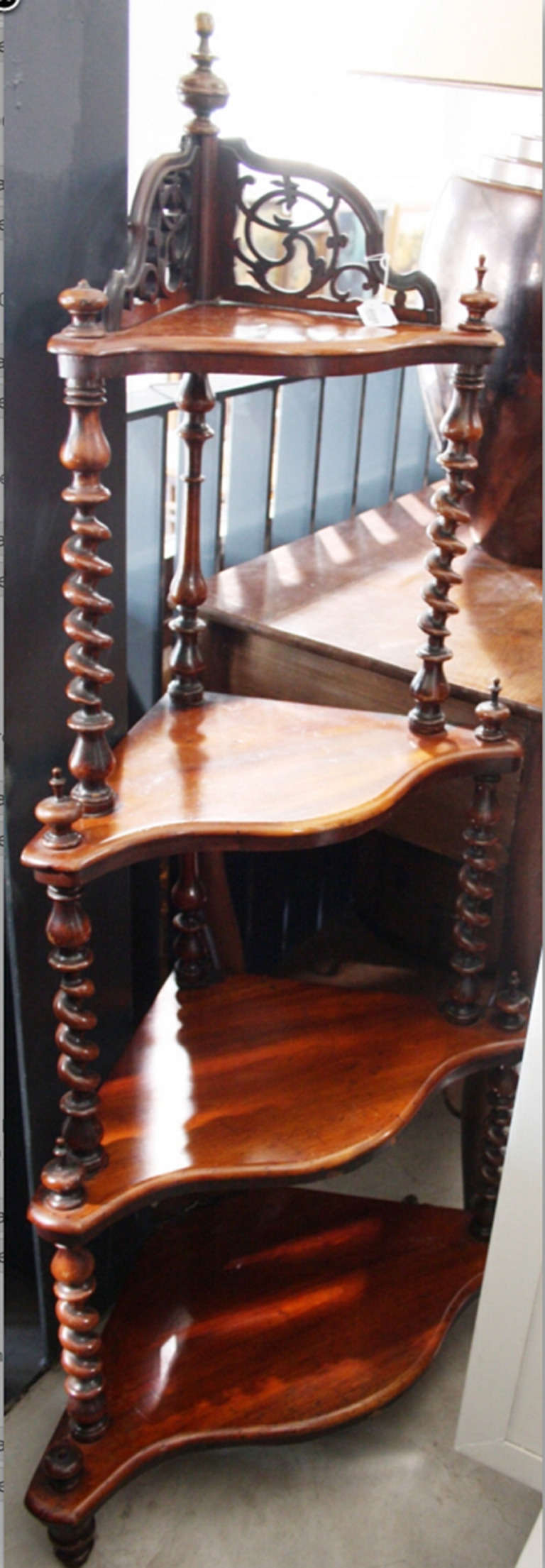 Monumenta Historica Departement 19th century fine art and antiques.

19th century English four-tier Victorian small mahogany corner whatnot stand (étagére) to be used either standing or hanging. Having shaped fronted shelves and barley twist