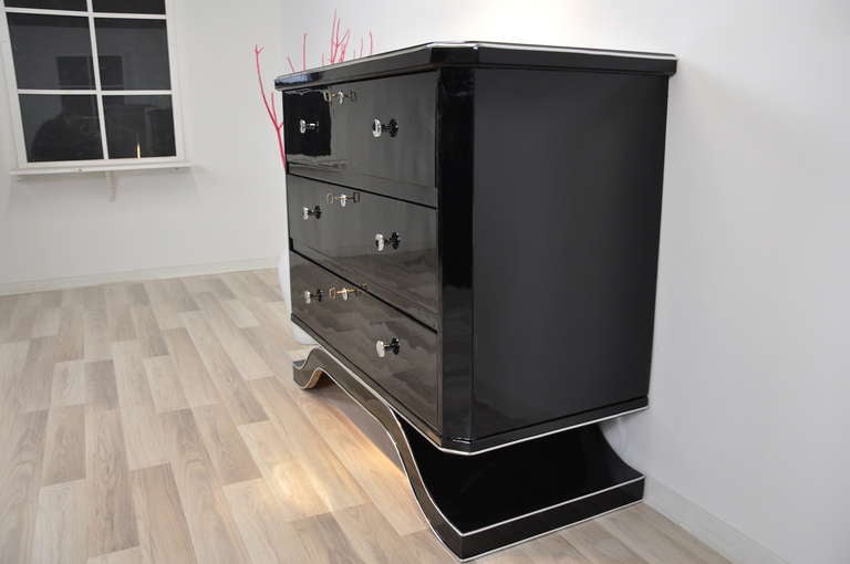 Polished Black Chest of Drawers For Sale