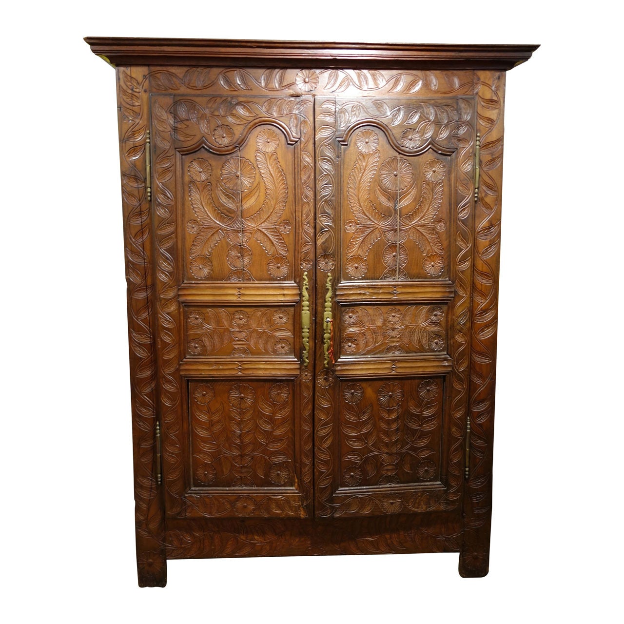 Early 19th Century French Armoire with Folky Elaborate Carvings