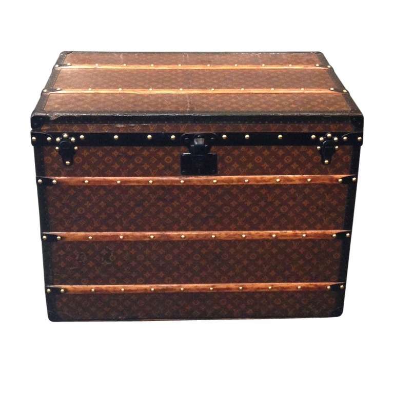 This wonderful steel bound Louis Vuitton trunk is sure to steal a piece of your heart when it securely stores your belongings or sparks meaningful conversation in your home. While it is common to see brass latches and leather handles, this trunk