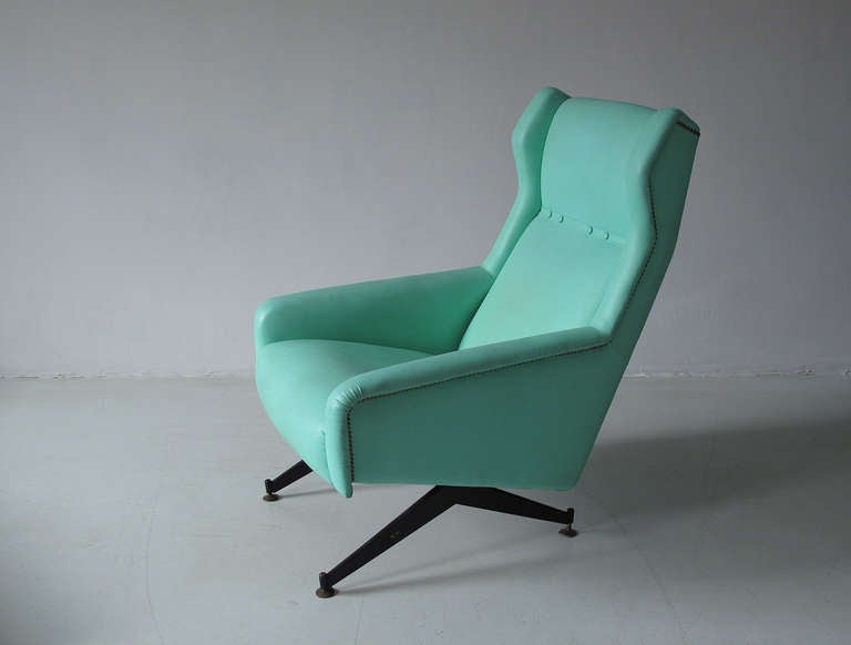 Elegant 1950s armchair with original turquoise skai cover. Iron base with brass feet. Brass nails all the way around the chair. Very nice original vintage condition. 

Measures: H 99 cm, D 78 cm, W 65 cm.