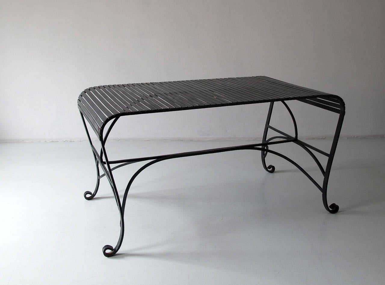 Mid-Century Modern, or late Art Deco 1930s-1940s iron garden table with black lacquering. Very nice, original vintage condition with some wear to the iron and the lacquering.
Measures: L. 140 cm, W. 80 cm, H. 73 cm.