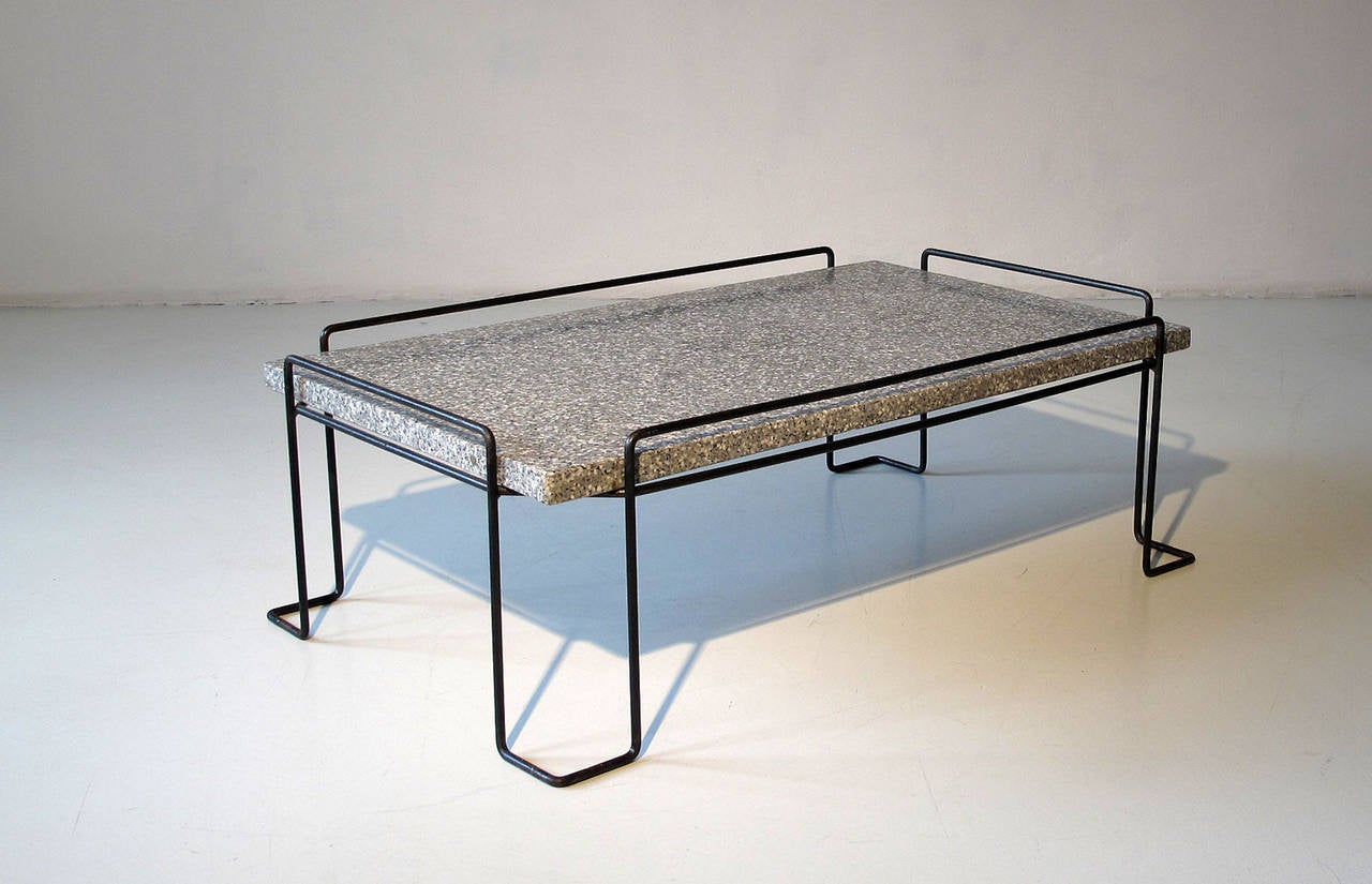 Mid-Century Modern, French or German 1960s garden or lounge table.
Polished terrazzo top on a black lacquered sculptural shaped iron base.
Most probably designed for outdoor use.
Perfect vintage condition with light patina to the iron