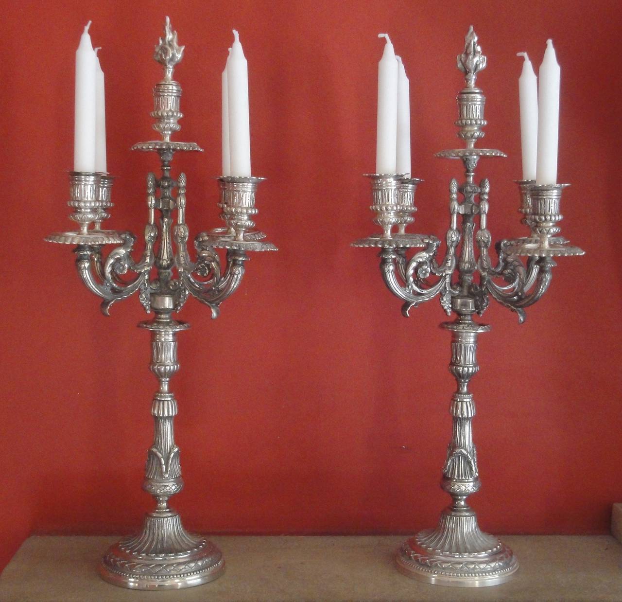 Superb pair of large heavy 4 branch or 5 candle candelabra .
Silver plated, with snuffers.
Impressive size 
Possibility of 4 or 5 candles, if using 4 leave the snuffers central top.
4 removable sconces on each.
Plating in good condition.
No