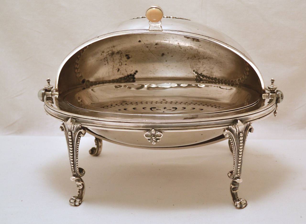 Super victorian breakfast server / Bacon dish
Adorned with swaged design on top see  image 1, 3,&4
Cylindrical action,
Drainer and receptacle plates inside see image 5
Mounted on cabriolet legs see image 8
Makers Mark Creswick & Co of Sheffield