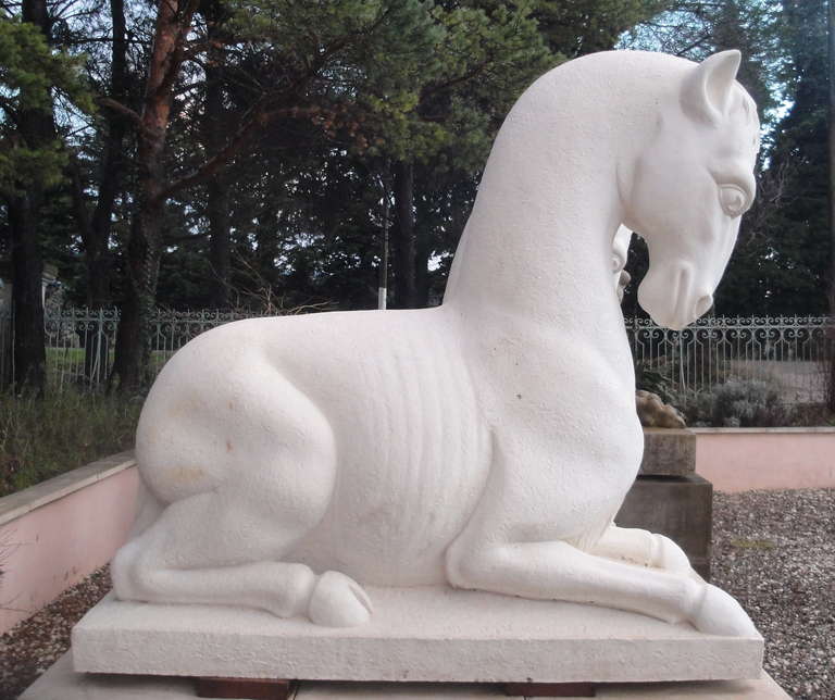 Pair of neoclassical cast stone horses on block plinths, with a very unique design.

Made in England and hand finished in Provence (France).

Currently only existing pair, commissioned from custom-made clay sculptures exclusive to Dickinson