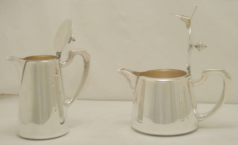 Made By Elkington & Co England.
Silverplated Tea Service
Excellent Condition
Each piece stamed see images below.
Dated 1947
Teapot dimensions  2 Pint Height 15cms diameter 12cms
Waterpot  1 1/2 Pint H 19cms D 10 cms
Milk Jug  11 OZ H 10 cms D