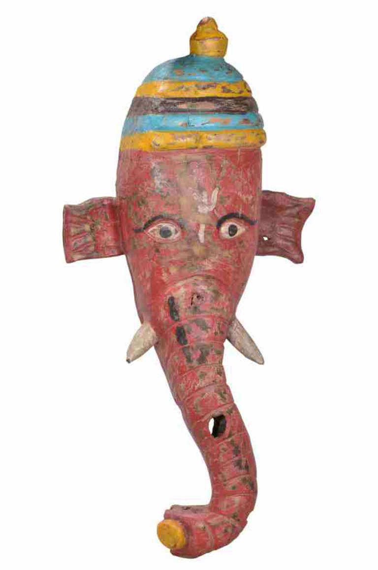 Ganesha elephant head ceremonial mask.  Ganesha is regarded as the  remover of obstacles, the patron of the arts and sciences and the deva of  intellect and wisdom.  Ganesha is also the god of beginnings, and is honoured at the start of rituals and