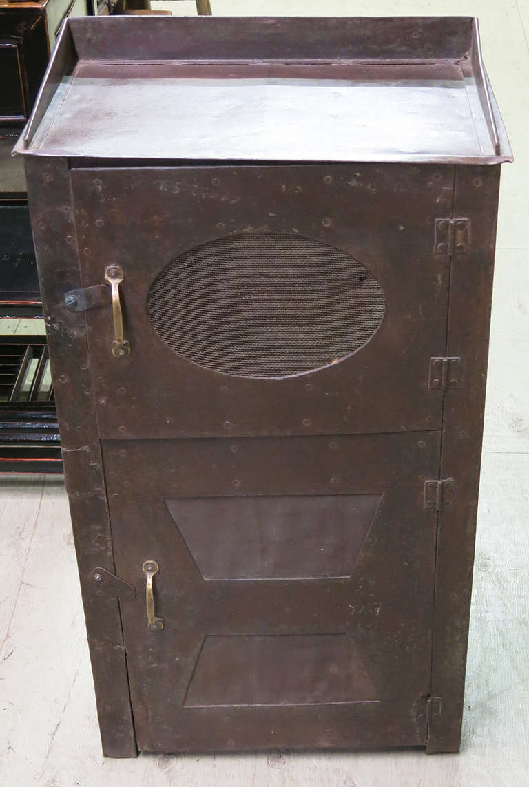 This is a mid century industrial cabinet that would have originally been used as a pie safe.  It has a great size and patina.