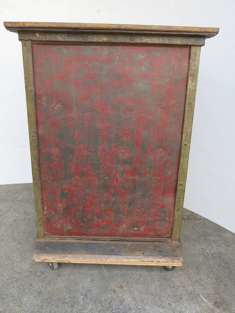 This a steel antique safe from India that retains a great deal of its original painted finish.  In the day this piece would have positively sparkled.