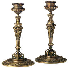 A pair of fine gilt bronze Renaissance revival candlesticks with bobeches.