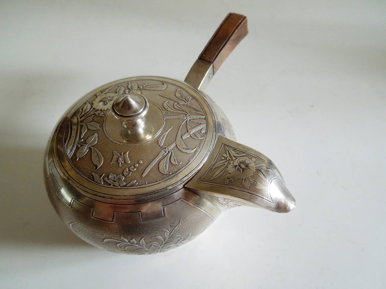 A silver teapot with engraved japonisme decoration by Veyrat. at 1stdibs