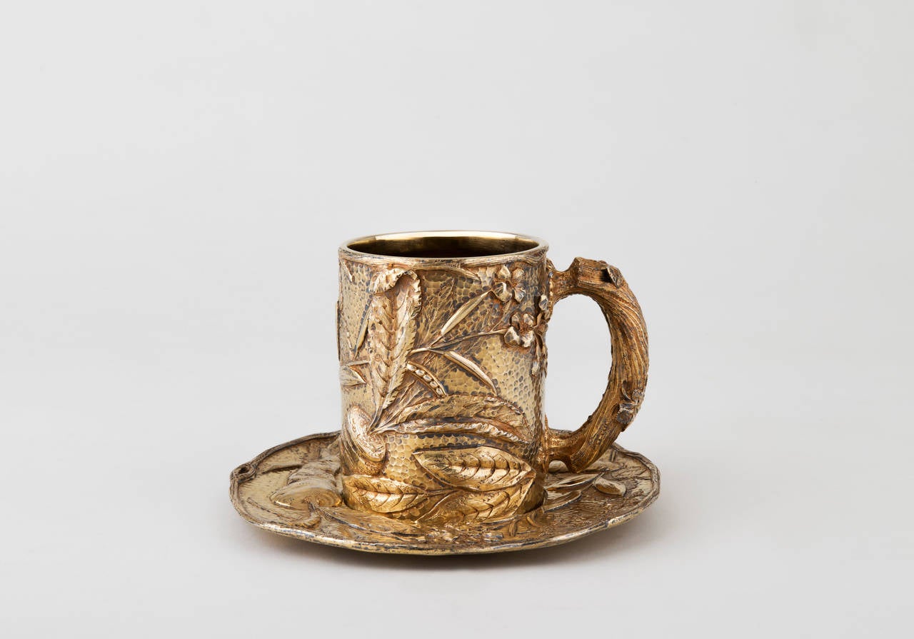 A French silver-gilt cup and saucer with naturalist decoration. Fully hallmarked and stamped BOUDET, 43 boulevard des Capucines, Paris. They moved to the place Vendome in 1908. Boudet was an important retailer specialised high quality decorative