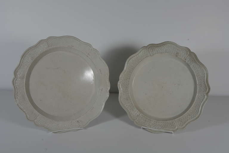 A pair of large creamware plates with scalloped and patterned borders. From Creil in Northern France. Price listed for the pair.