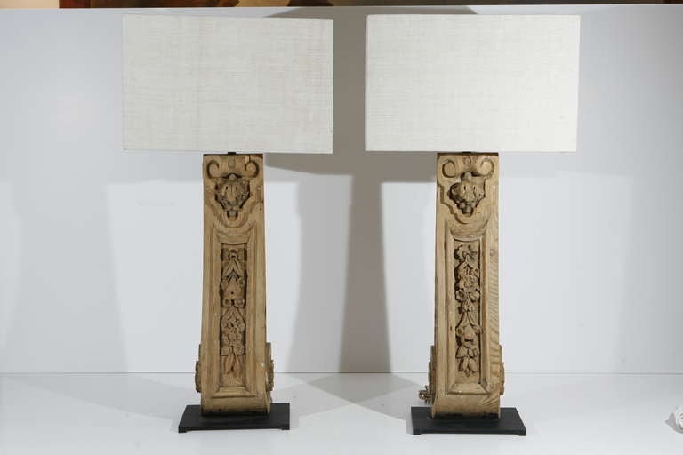 A Pair of Table Lamps made from French Wooden Corbel Architectural Elements from the 19th century

Mounted on sturdy metal bases with half-rectangular shades at cost

12