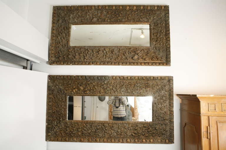 A pair of painted papier-mâché frames of intricate detail with original mirrors. Price listed for the pair. Can be sold separately.