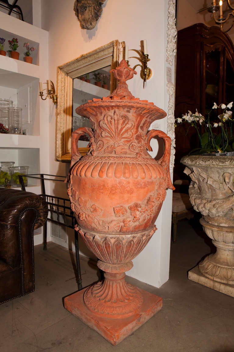 a pair of large red terracotta urns in beautiful condition
each is in three pieces - base, mid section, and lid

French, late 19th century