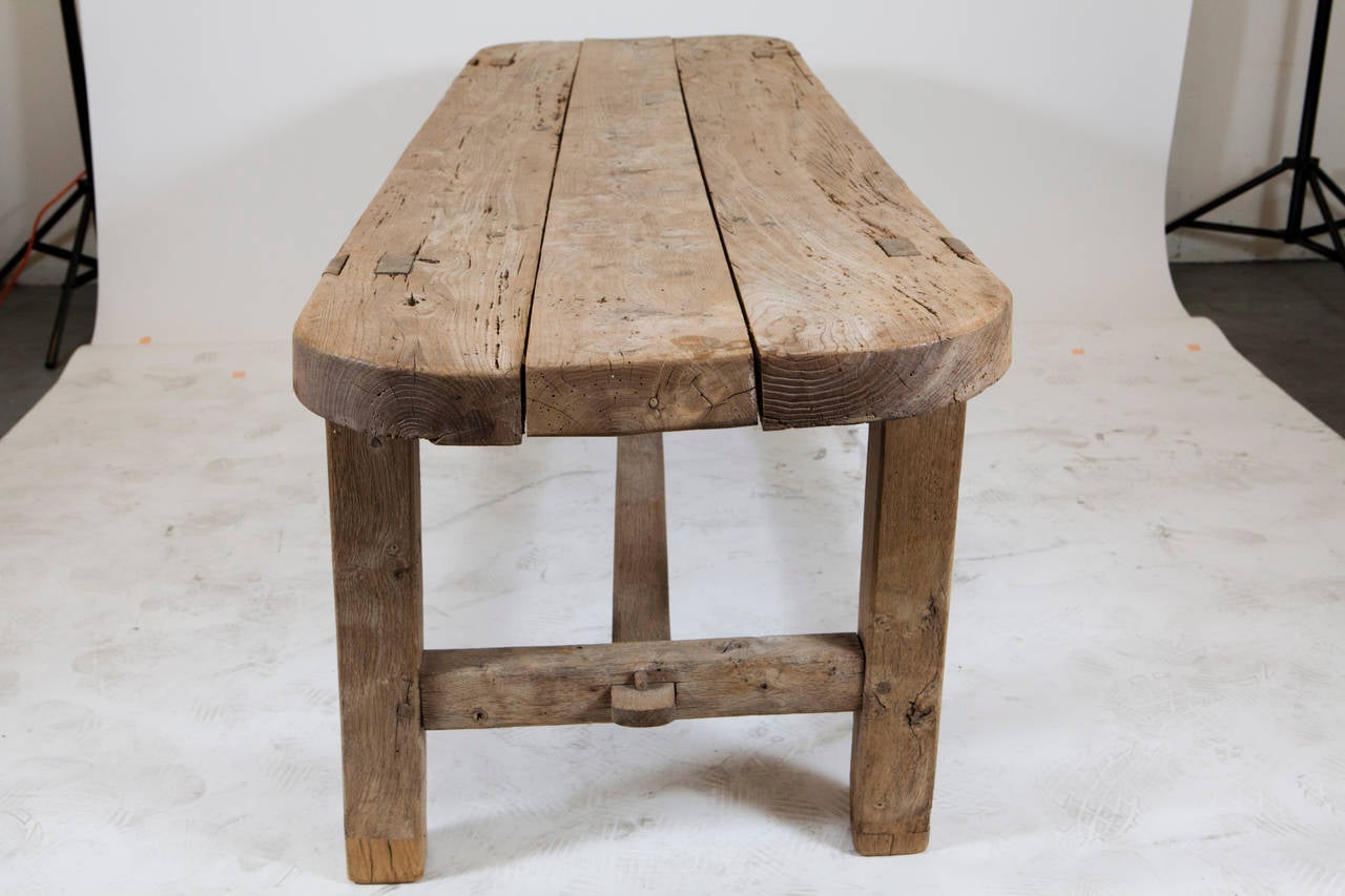 A natural pine kitchen table with thick top. Very sturdy, beautifully crafted, and a great piece for a French Provence style home.