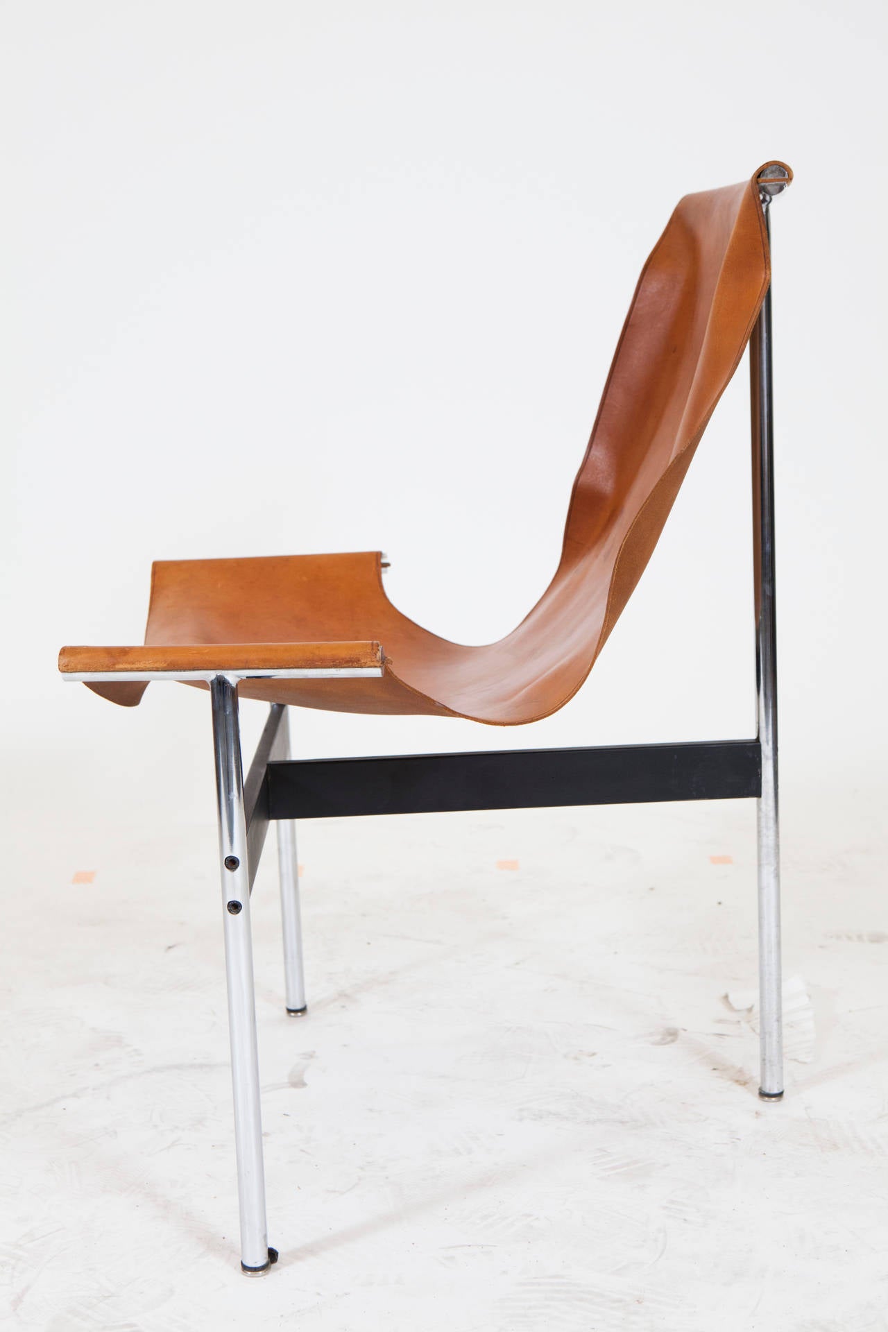 Designed by William Katavolos in 1953 the T-Chair gets its name for the 