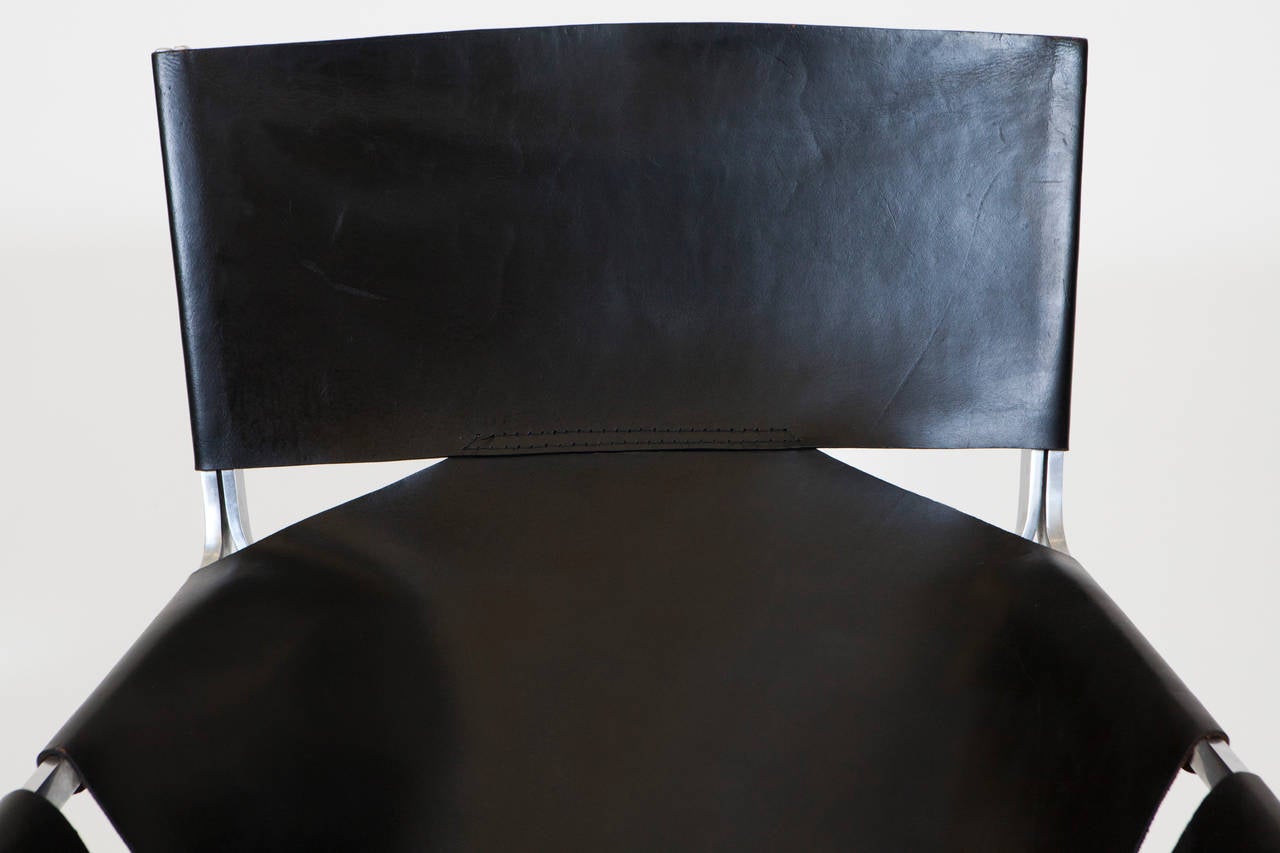 Pierre Paulin leather lounge chair, 444 model in original black leather with steel support and legs.