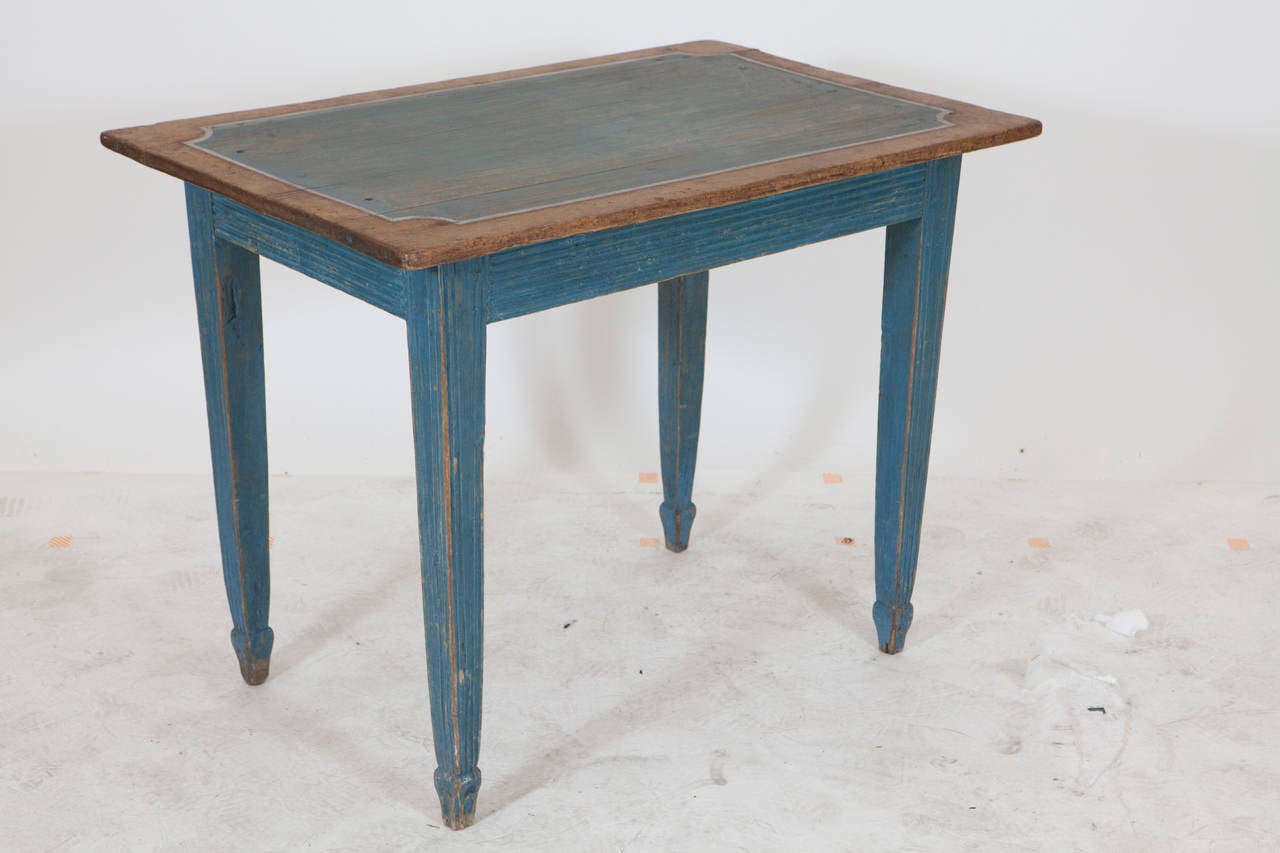 A small light blue painted and natural wood Gustavian side table from Sweden. 19th Century and quite great for a kitchen or study accent piece.