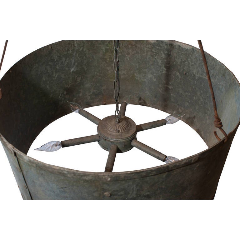 A large round drum chandeliers made from zinc. A pair is located in Los Angeles and a second pair is located on the east coast. Item is priced individually.