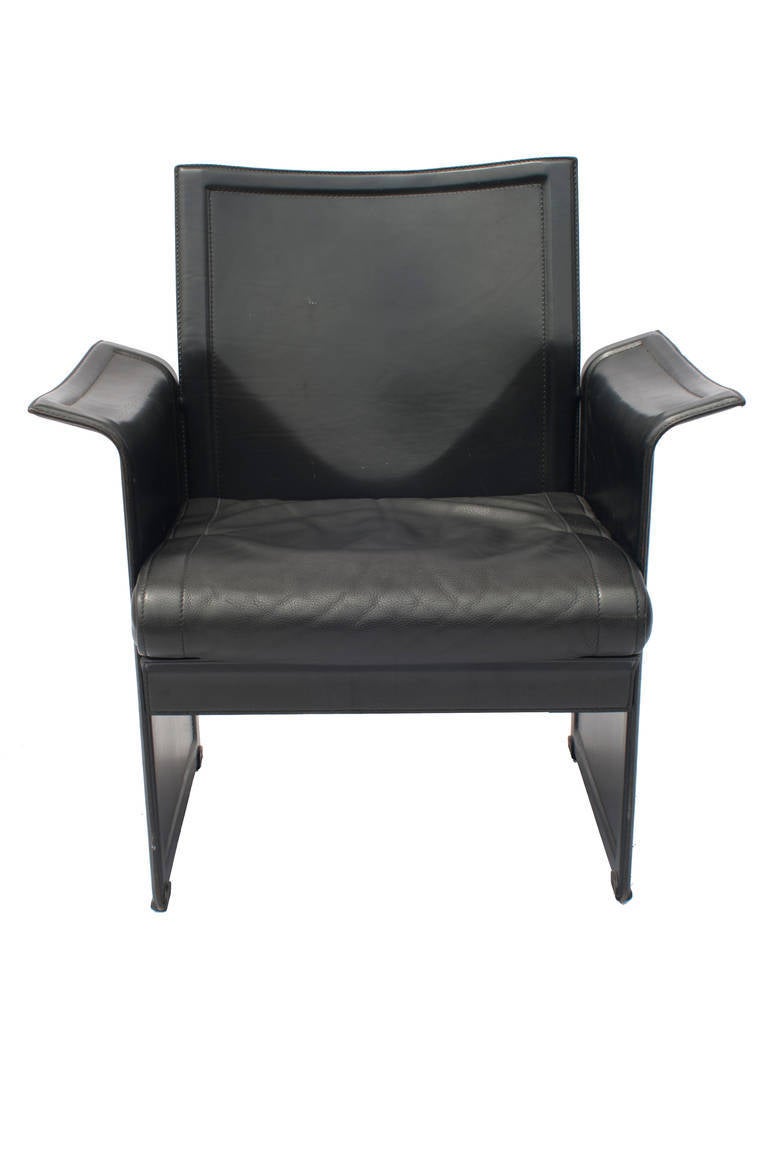 Set of four Italian black leather armchairs manufactured by Matteo Grassi. These 