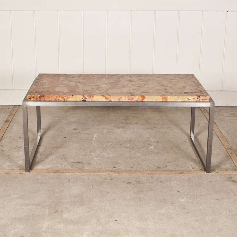 This rare Breche d'Alep Marble Top Coffee Table with a Cold Rolled Steel Base is tres Magnifique!  The clean subtle lines of the base showcase the intricate veining and golden tones of the marble top.