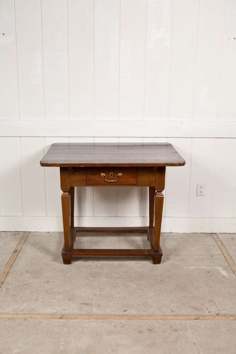 This late 18th Century Belgian Side Table is made of walnut and has a large over-scaled top.  This would well as a side table, a bedside table, a console.