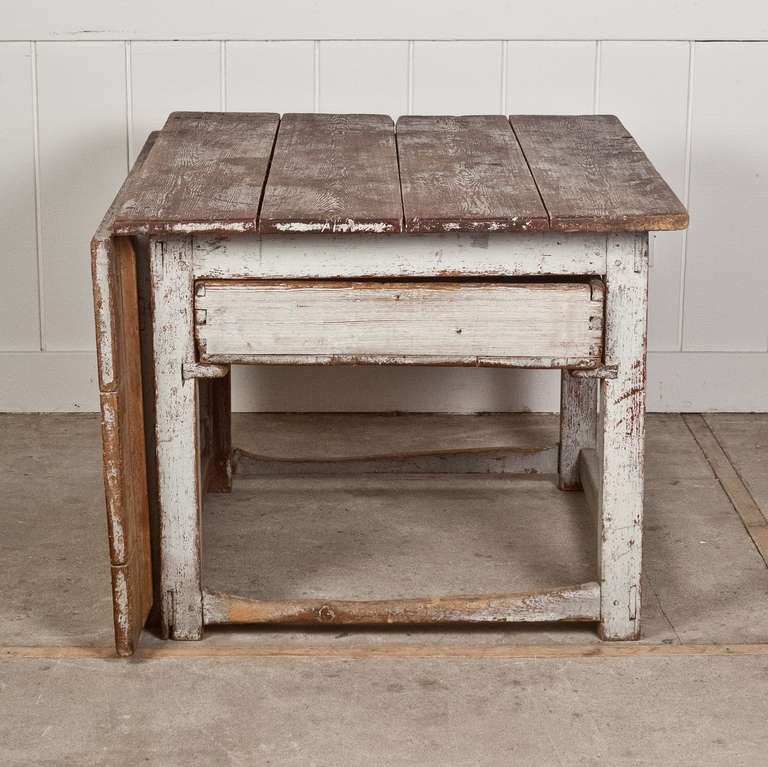 This Wonerful 18th Century Swedish Drop Leaf Table has a single drawer that passes through from side to side.  Painted Gray - Original Paint