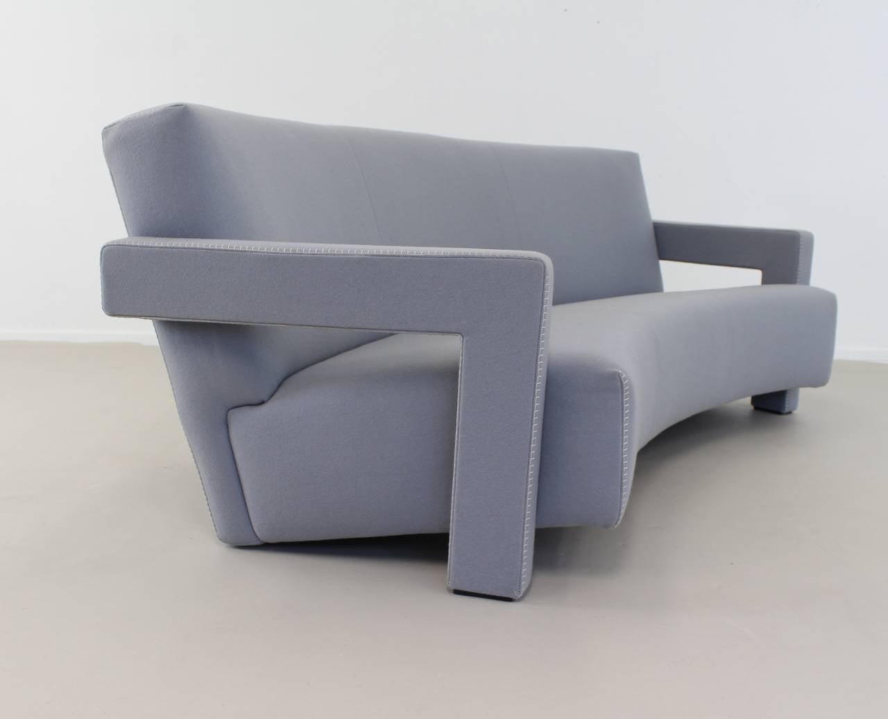 Seating group of three-seat couch and lounge chair.
Designer: Gerrit Thomas Rietveld.
Manufacturer: Cassina.
Licensed production of the original model (1988).
Bleu felt upholstering with feston stitches.
Model: Utrecht.
Chair size: 64 cm X 75