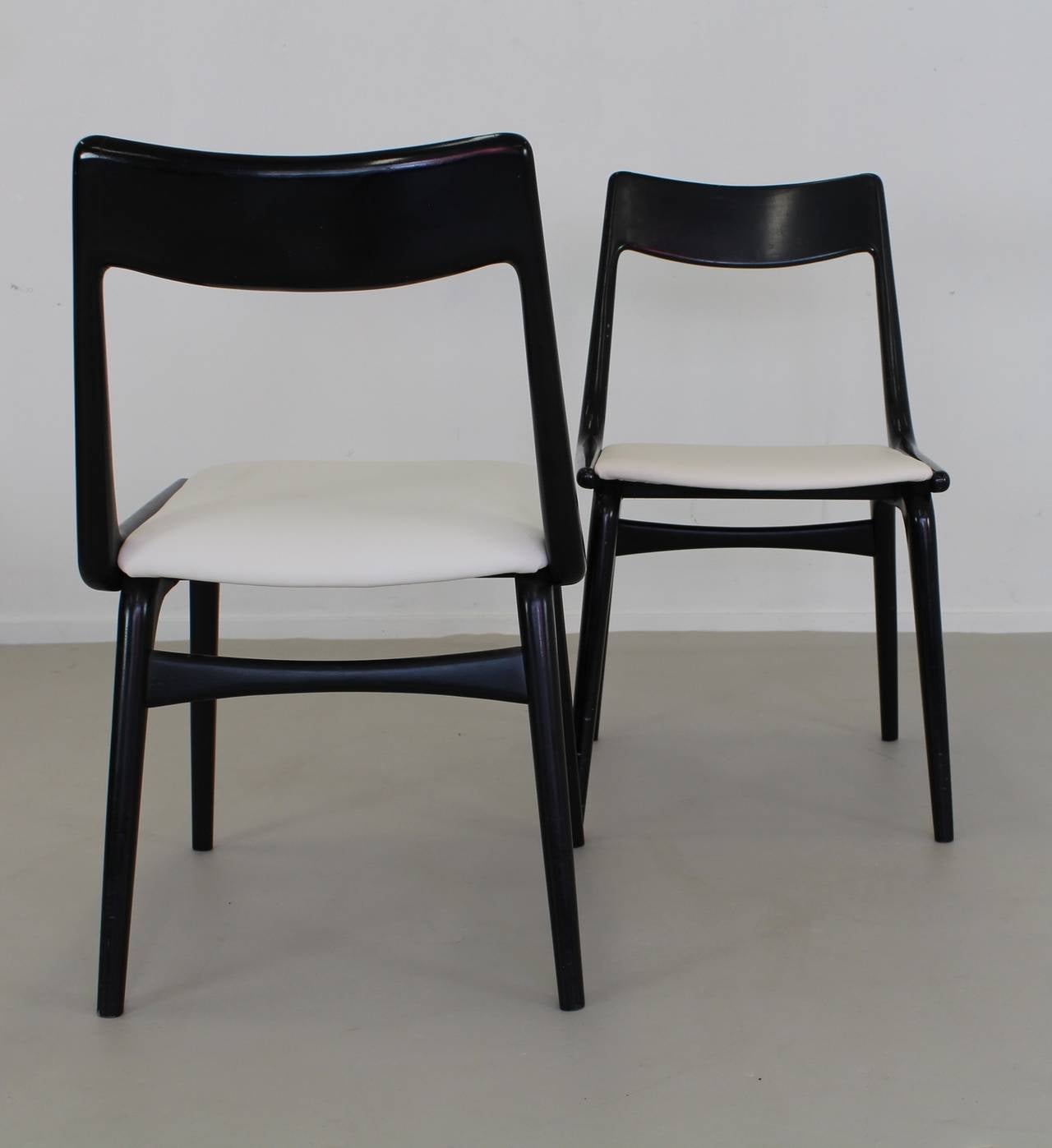 Six original sixties black boomerang chairs.
Designer: Erik Christensen.
Manufacturer: Slagelse Mobelvaerk.
Massive black painted wood.
Seats covered with white leather.
Very elegant set.