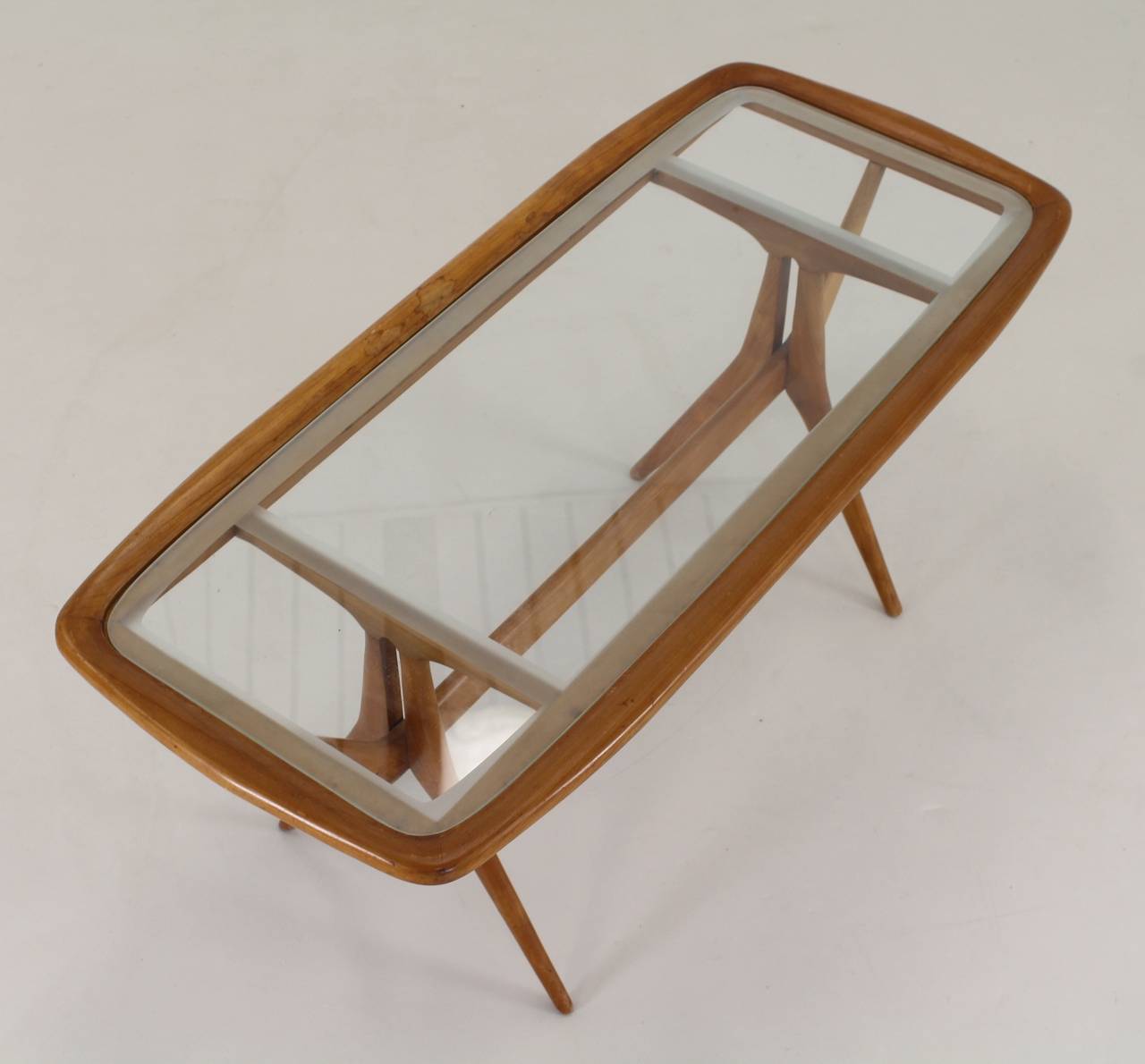 Elegant minimalistic coffee table
walnut with special treated glass
attributed to Cesare Lacca for Cassina, Italy.

Standard parcel shipment advised