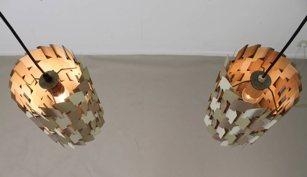 Two metal pendant lamps.
Designed by Louis Weisdorf.
Model: Facet Pop.
Pictured with two different bulb lamps for lighting effect.
Lamps are identical.

Express parcel shipment is advised
