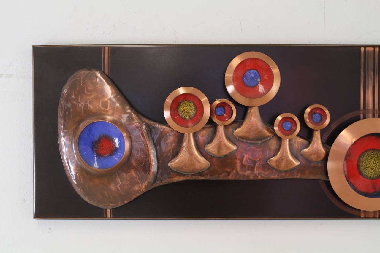 Nice German design wall decoration.
Fresh colored enamel with copper colored metal forms.