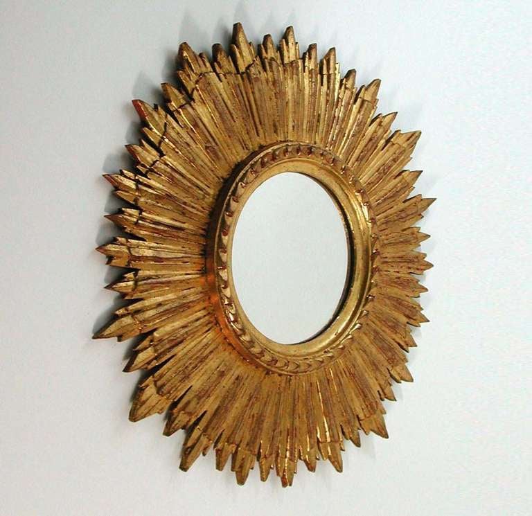 Beautiful gilt wooden starburst wall mirror, made in France in the 1950s.